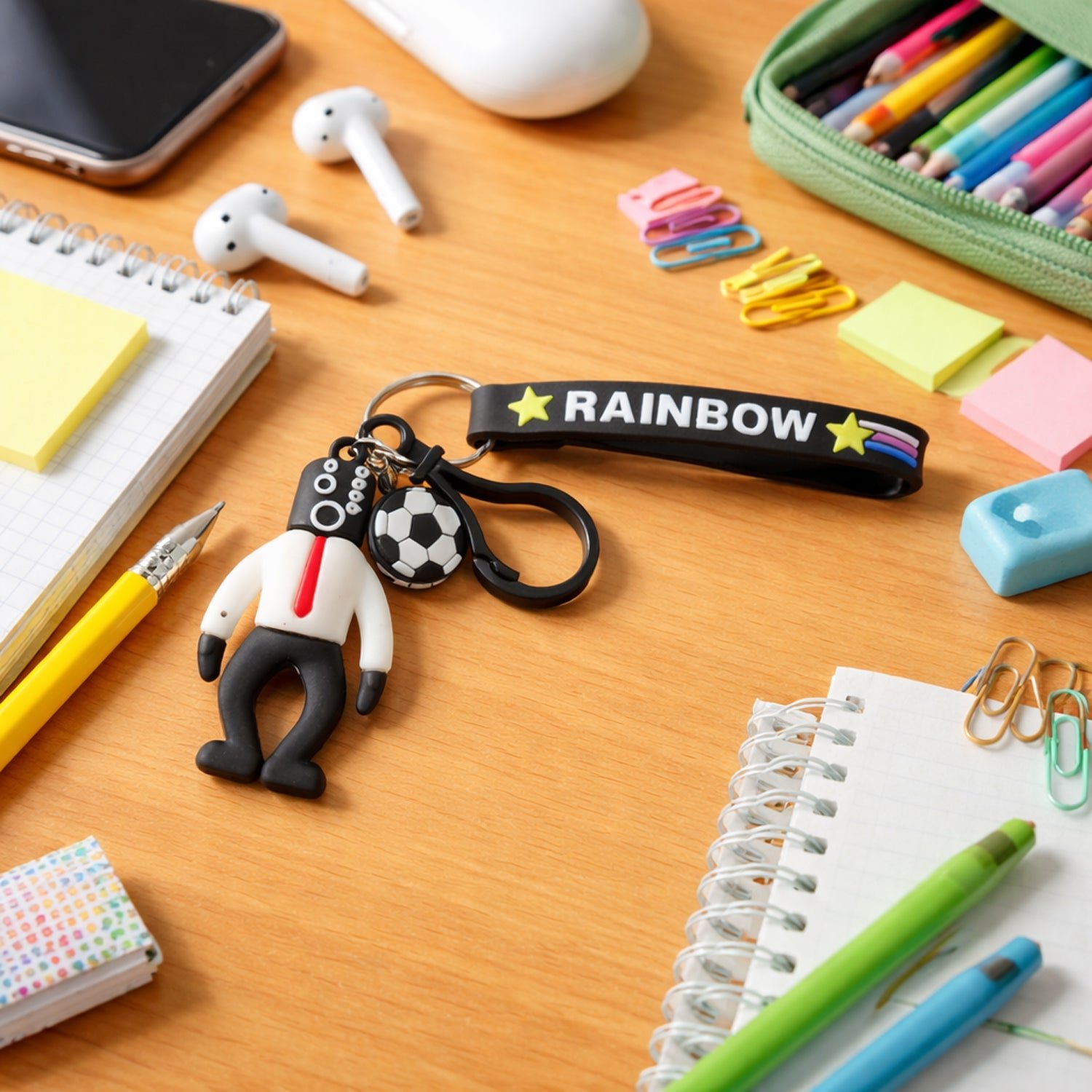 01_c6954289-f4d1-4cb1-a3da-abc7840f33bf.jpg Rainbow Strap Cartoon Football Boy Keychain (1 Pc) - Image 1