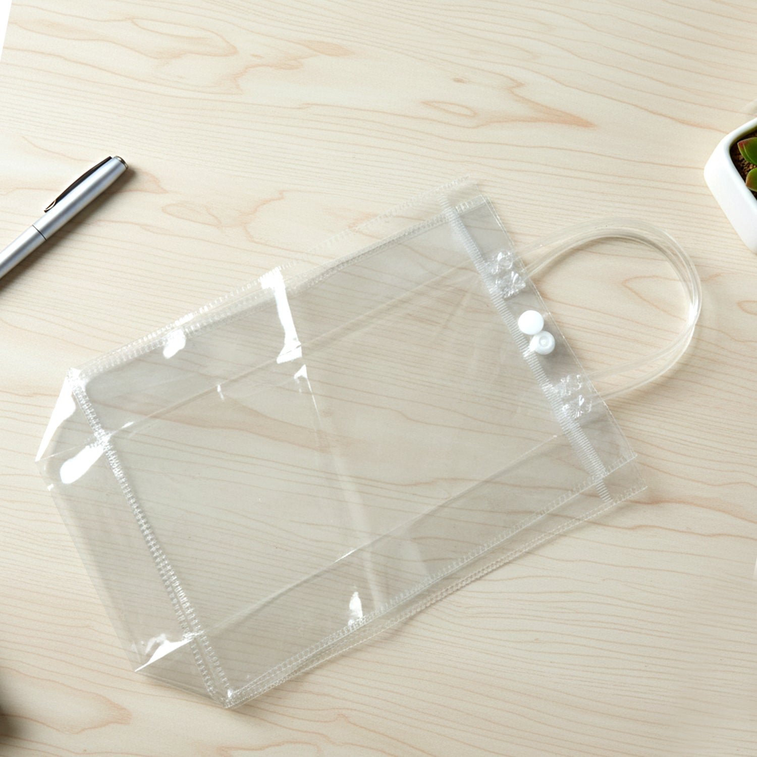 02_bc15b042-0585-4bab-a319-345ac9ed882e.jpg Transparent PVC Carry Bag (1 Pc, 22 x 16 Cm) - Image 1