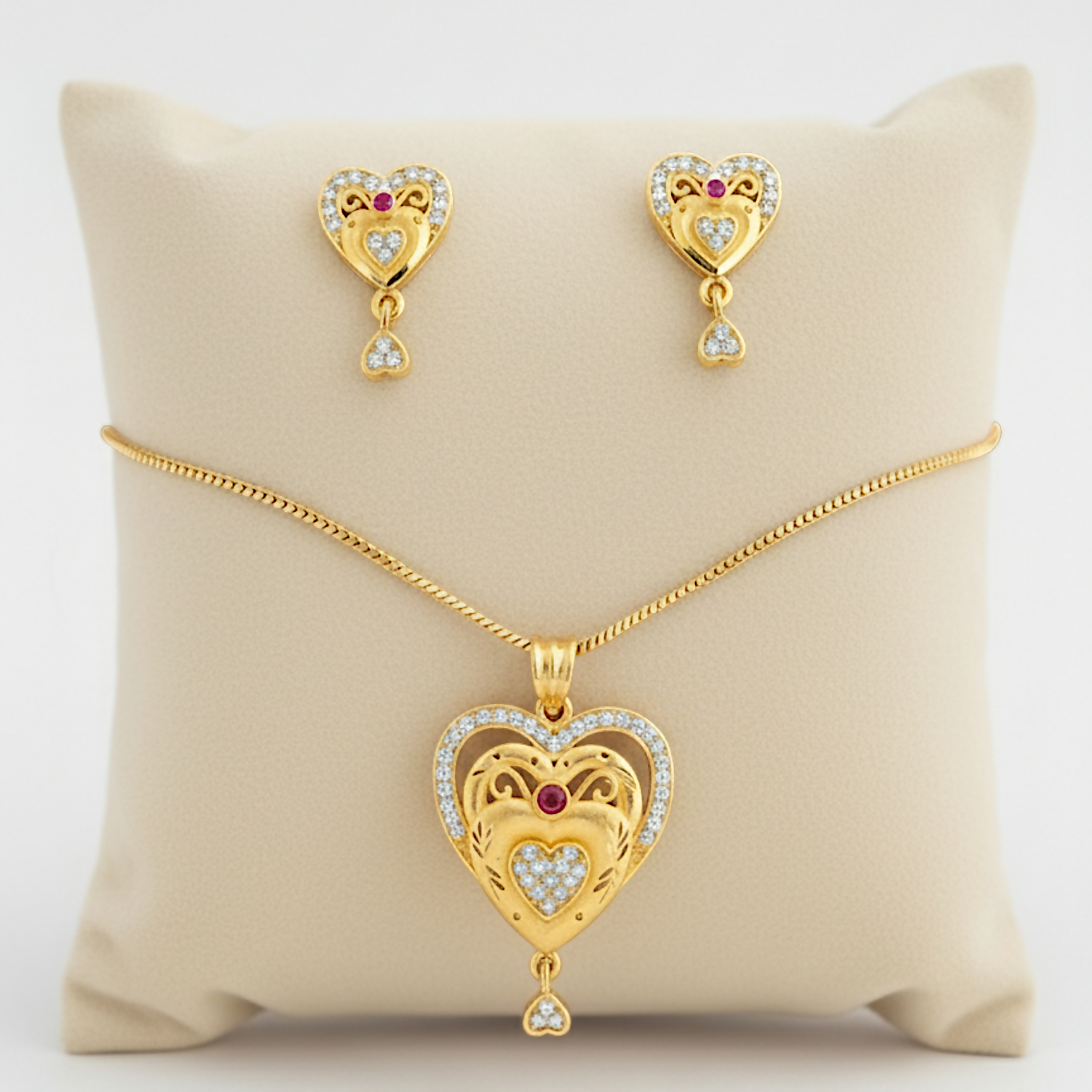 2EtWb1pO5K.png Gold-plated Heart Pendant and Earrings Set with Ruby and Cubic Zirconia - Image 1