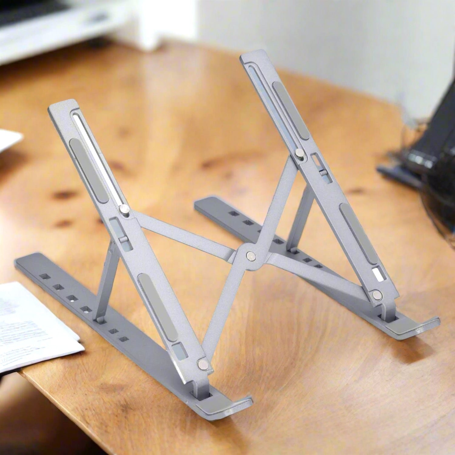 01_ec435053-2615-4cc3-9952-70a695868ef7.jpg Metal Portable Laptop Stand, with 7 Adjustable Angles (1 Pc) - Image 1